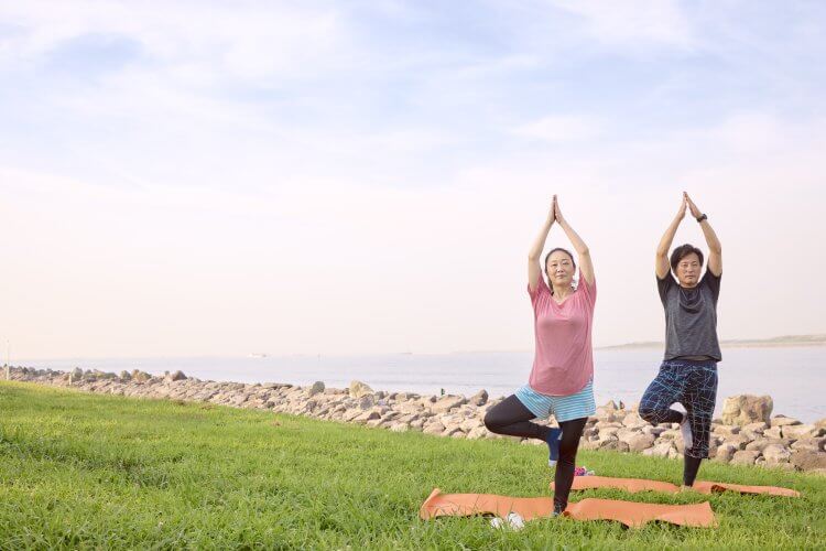 The two of them work out early in the morning under blue